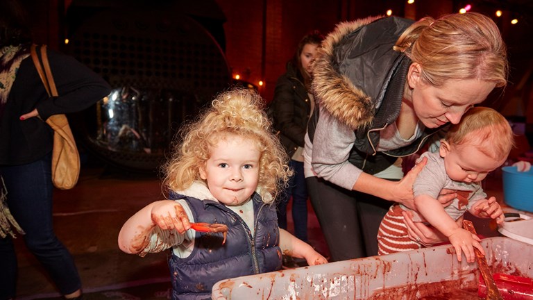 Children participating in Bugs in Mud activities during Little Kids Day In event in Scienceworks