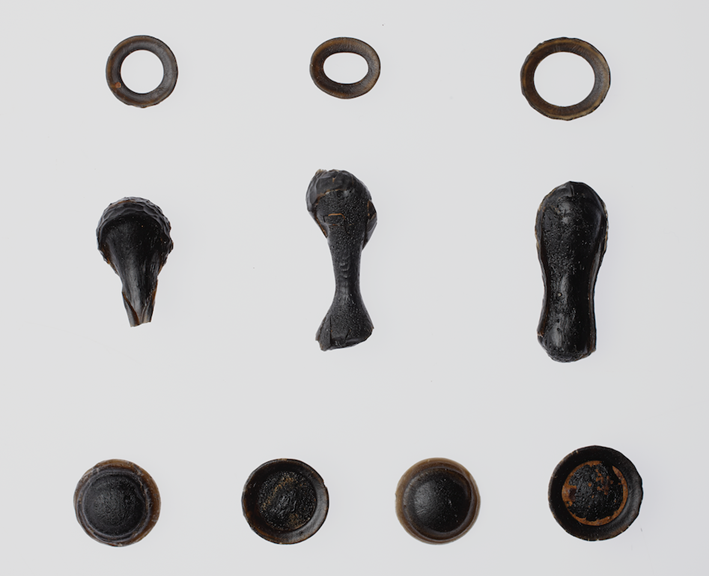 An array of oddly shapped black rocks. 