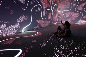 Wall and floor projections in the Learning Lab showcase.