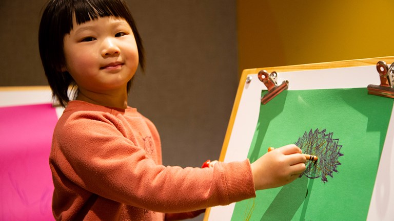 Child creating their own story of Caring for Country by colouring a native animal in the Energy LAB, during the Little Kids Day In - Caring for Country program at Scienceworks, August 2022.