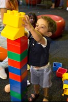  Boy building a block tower at Little Kids Day In event in Scienceworks.